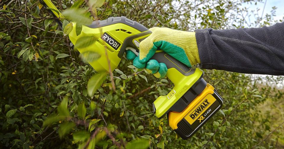 Ryobi One+ hedge trimmer with DeWalt battery