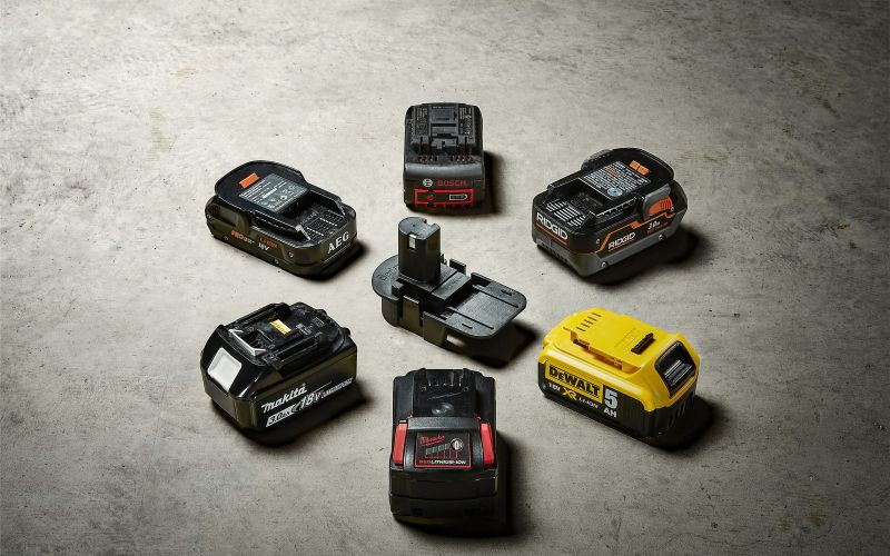 Power tool batteries in a circle around Badaptor