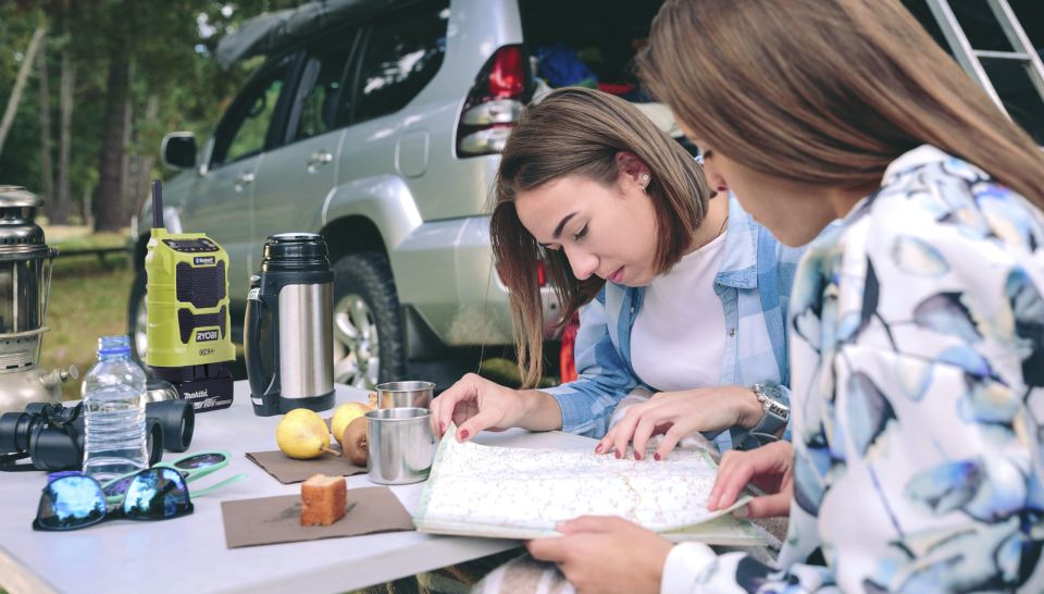 Women on outdoor adventure with radio in background