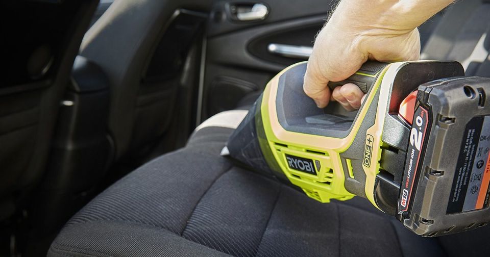 Ryobi One+ cordless vac cleaning car seat