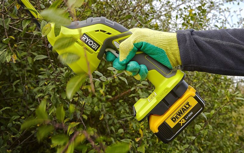 Ryobi One+ hedge trimmer with DeWalt battery